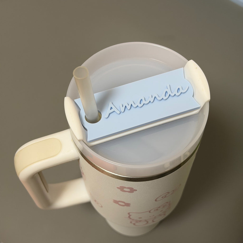 Close-up of raised white name lettering on cup topper